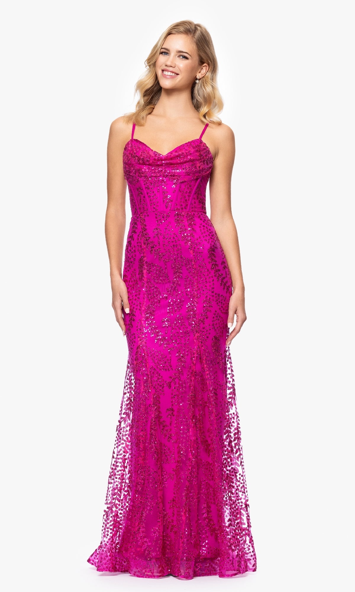 A woman models the Blondie Nites 4623BN Long Glitter Prom Dress, featuring bright pink sequins, spaghetti straps, and a fitted bodice. This elegant, sparkly evening gown stands out against a plain white background.